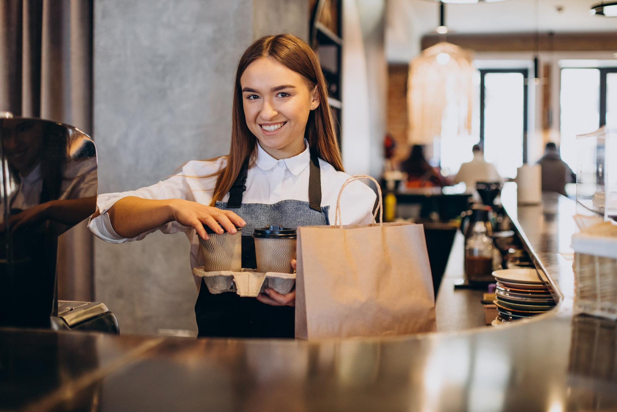 Bartender preparing drinks behind a bar