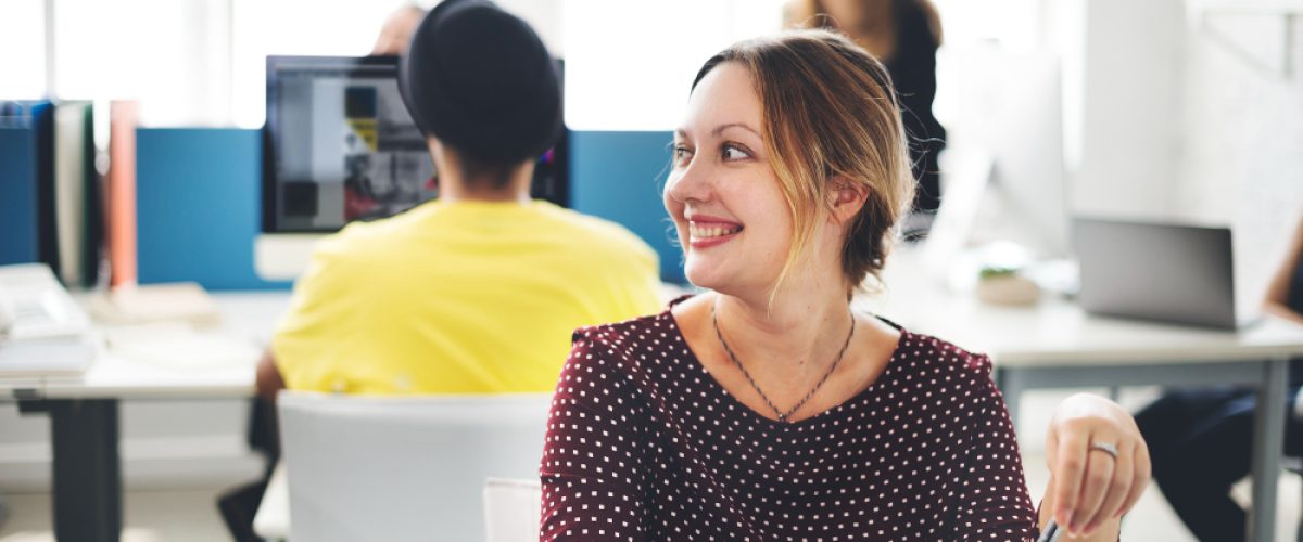 closeup-cheerful-caucasian-woman-working-office closeup-cheerful-caucasian-woman-working-office